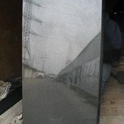 На фото памятник в форме волны. Фото памятника сразу после изготовления. Производство памятников из чёрного габбро в Киеве, с гарантией 10 лет. Доставка и установка на всех кладбищах Украины.