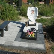 Детский памятник после установки на кладбище. Размер памятника младенцу: 120 х 70 х 15 см. Фото памятника ребёнку после установки.